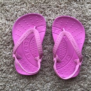 Pink Crocs flip flops